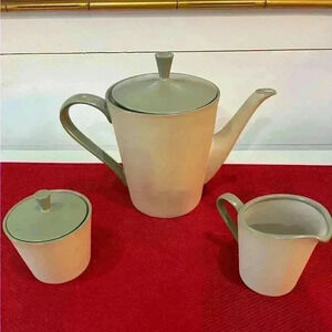 Vintage 1965 teapot, creamer, and sugar bowl signed on the signed WEO 65